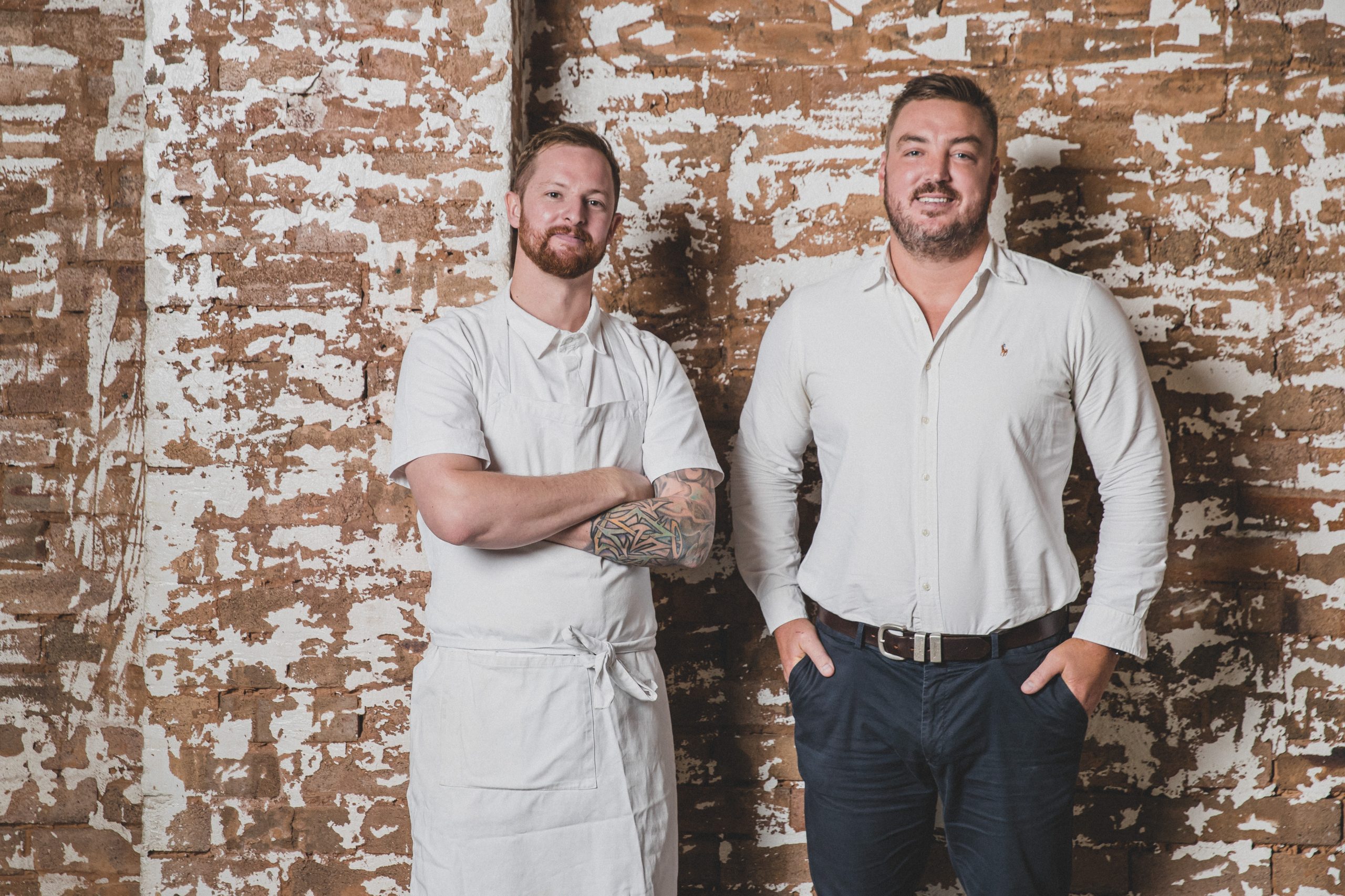 Image of Jacksons on George's head chef Steven Sinclair and Publican Mike Broome standing together in front of a brick wall.