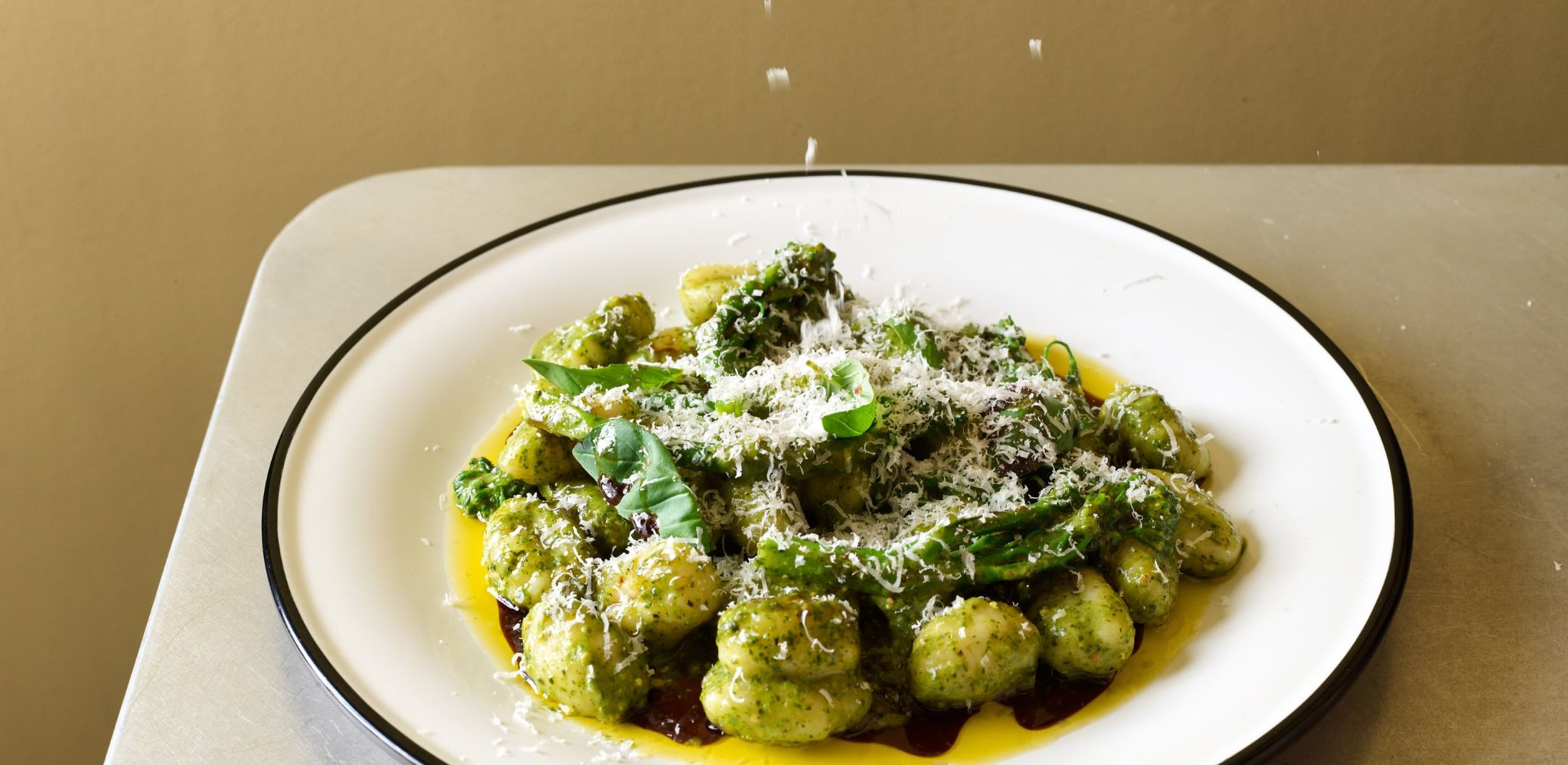 Pistacchio pesto gnocchi, brocoli, basil with grated parmesan on top