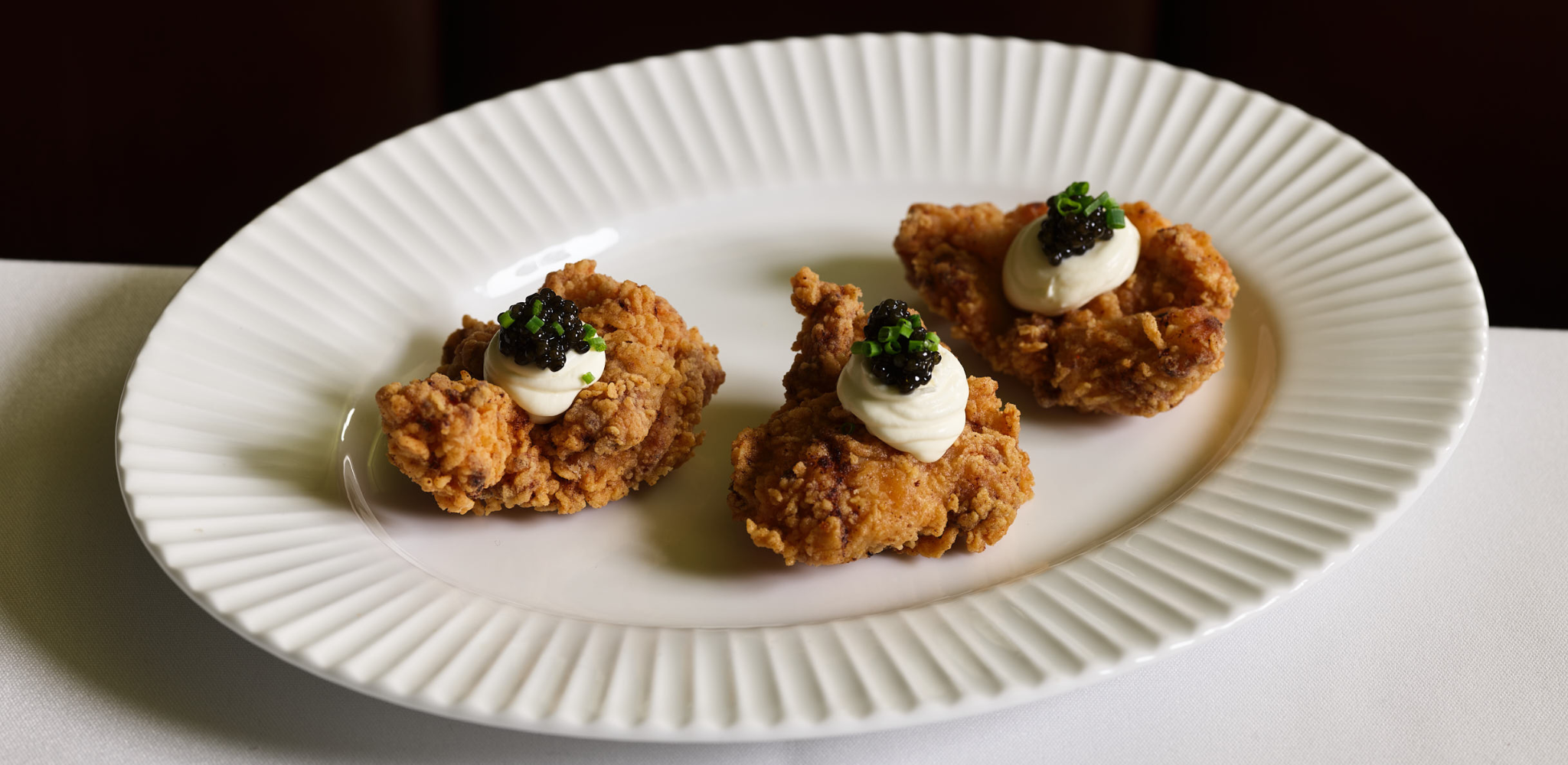 Fried chicken, cultured cream, oscietra caviar, chives